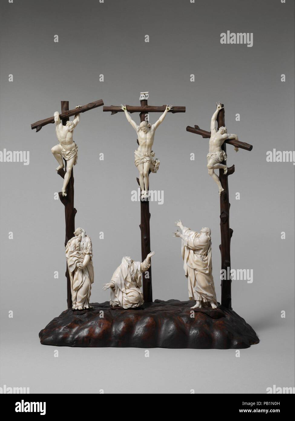 Crucifixion. Culture: possibly German or Netherlandish. Dimensions: Height (.182a, with cross): 21 1/8 in. (53.7 cm);  Height (.182a, figure only): 8 1/2 in. (21.6 cm);  Height (.182b, with cross): 20 1/8 in. (51.1 cm);  Height (.182b, figure only): 8 in. (20.3 cm);  Height (.182c, with cross): 20 1/8 in. (51.1 cm);  Height (.182c, figure only): 8 1/8 in. (20.6 cm);  Height (.182d): 4 1/4 in. (10.8 cm);  Height (.182e): 6 7/8 in. (17.5 cm);  Height (.182f): 7 1/2 in. (19.1 cm). Date: late 17th-early 18th century.  Calvary was the hill outside Jerusalem where Christ was crucified. Here, the tra Stock Photo