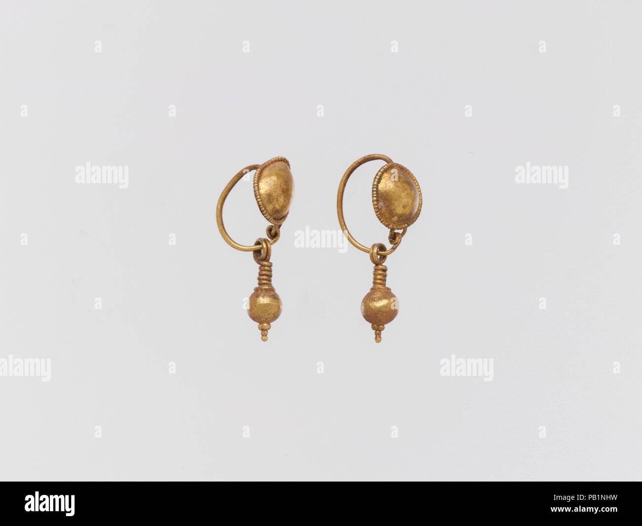 Earring with pendant. Dimensions: Other: 5/16 x 3/8 x 7/8 in. (0.8 x 1 x 2.3 cm). Museum: Metropolitan Museum of Art, New York, USA. Stock Photo