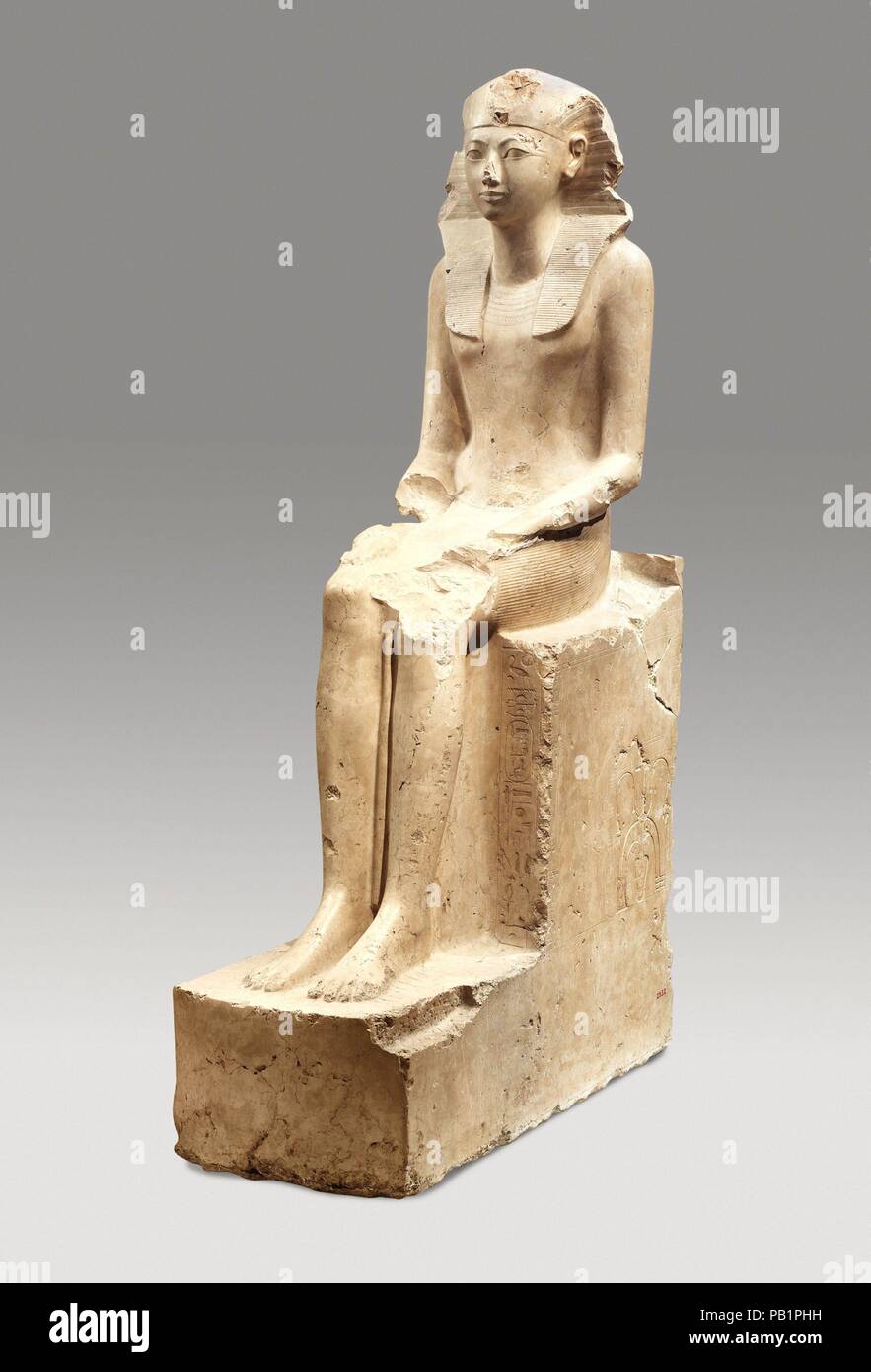 Seated Statue of Hatshepsut. Dimensions: H. 195 cm (76 3/4 in.); W. 49 cm (19 5/16 in.); D. 114 cm (44 7/8 in.). Dynasty: Dynasty 18. Reign: Joint reign of Hatshepsut and Thutmose III. Date: ca. 1479-1458 B.C..  Hatshepsut, the most successful of several female rulers of ancient Egypt, declared herself king sometime between years 2 and 7 of the reign of her stepson and nephew, Thutmose III. She adopted the full titulary of a pharaoh, including the throne name <i>Maatkare</i>, which is the name most frequently found on her monuments. Her throne name and her personal name, Hatshepsut, are both w Stock Photo