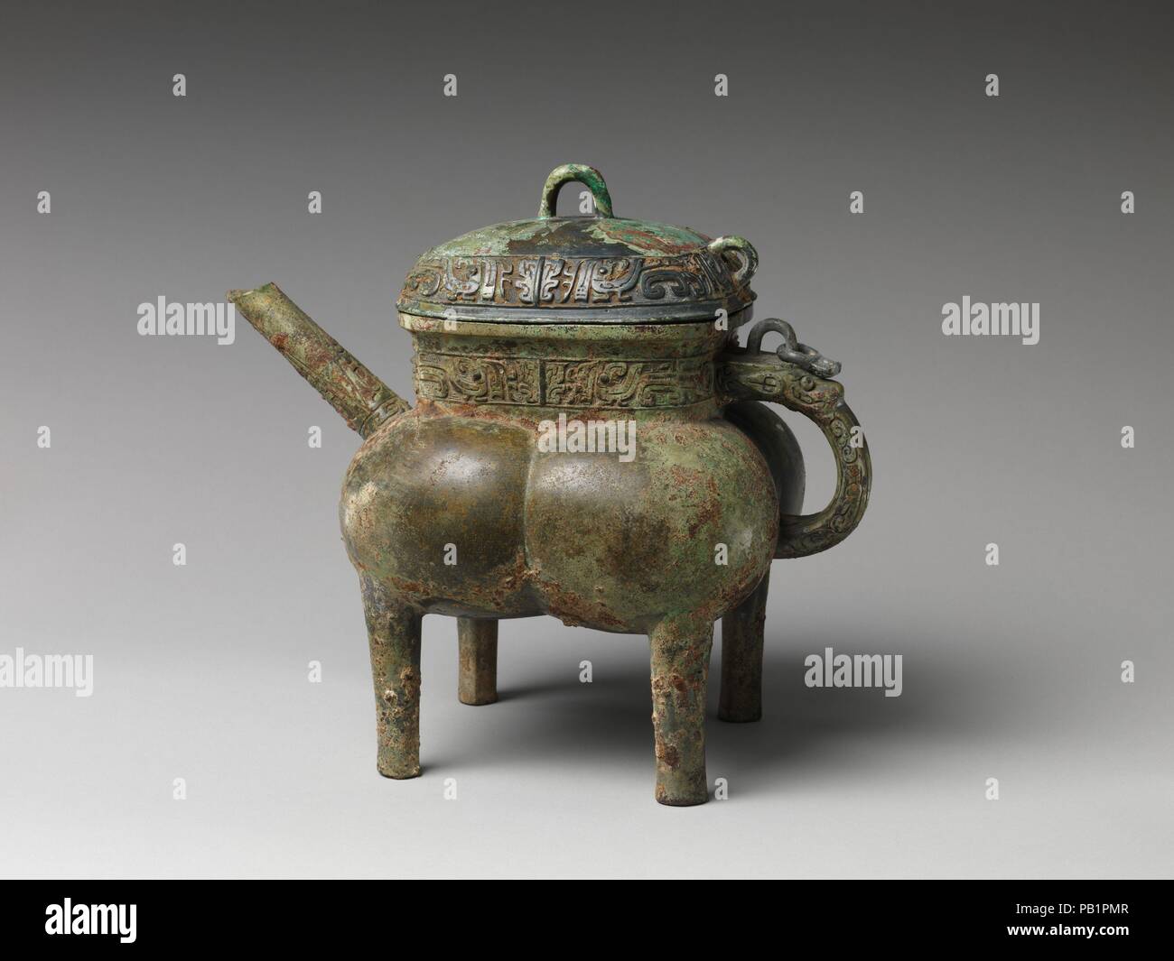Spouted Wine Vessel (He). Artist: Yin Lingde (Chinese). Culture: China. Dimensions: H. 10 3/4 in. (27.3 cm); W. 7 3/4 in. (19.7 cm); L. (with spout and handle)  12 1/4 in. (31.1 cm). Date: 12th-11th century BC. Museum: Metropolitan Museum of Art, New York, USA. Stock Photo