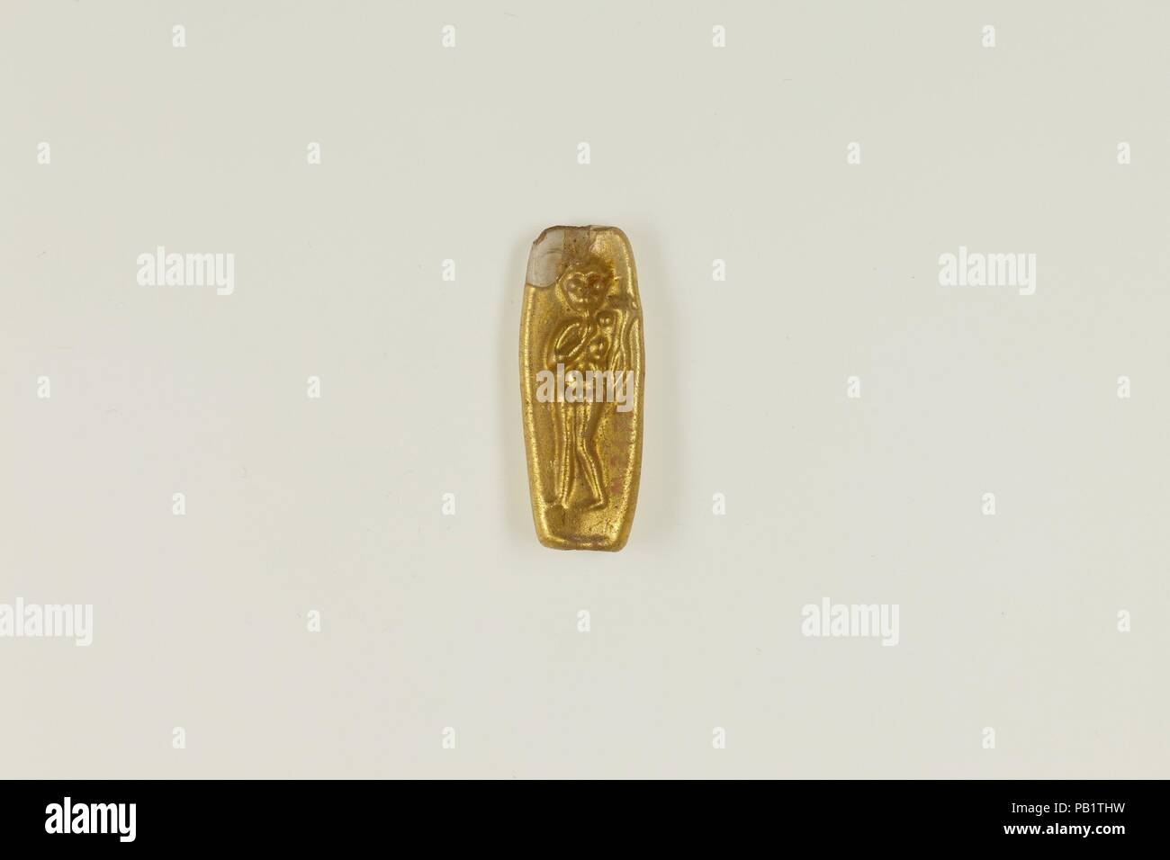 Bead with figure of Harpokrates. Dimensions: H. 2.7 × W. 1 cm (1 1/16 ×  7/16 in.). Date: 100 BC-100 AD. Gold glass beads were a Hellenistic  development. They were created by