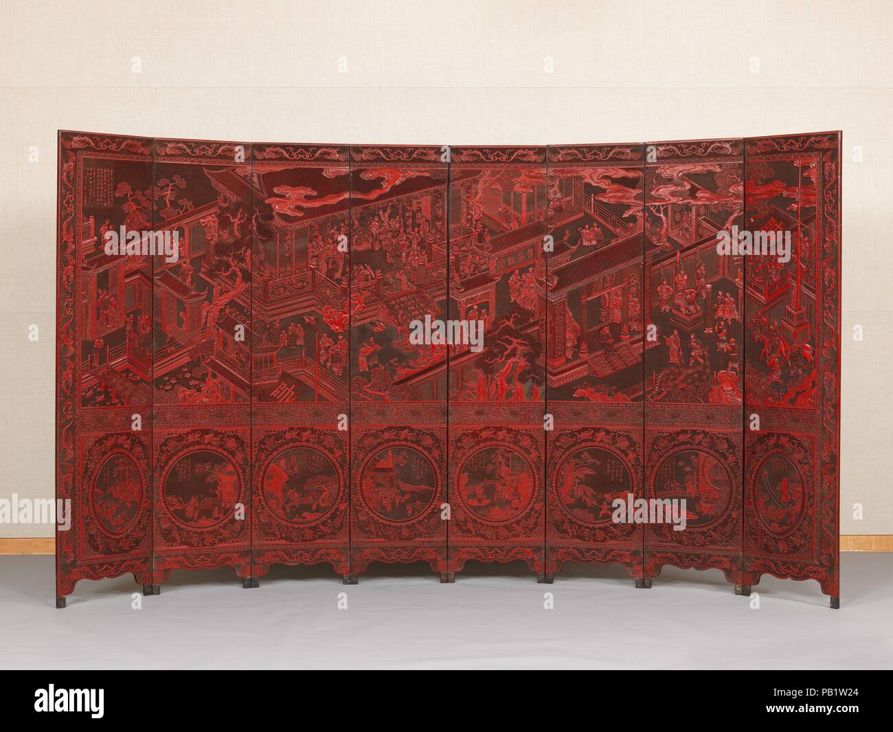 Screen with birthday celebration for General Guo Ziyi. Artist: Lu Guisheng (Chinese, active 1821-50). Culture: China. Dimensions: Open flat: 84 1/8 in. × 12 ft. 4 in. (213.7 × 375.9 cm)  Open curved: 84 1/8 in. × 11 ft. 3 13/16 in. × 35 7/16 in. (213.7 × 345 × 90 cm). Date: mid-19th century.  The inscription in the upper right indicates that the screen was made in honor of a certain General Zhen, most likely upon an important birthday, such as his sixtieth. The primary decoration records a celebration for Guo Ziyi (697-781), one of the most famous generals in Chinese history--an obvious compli Stock Photo