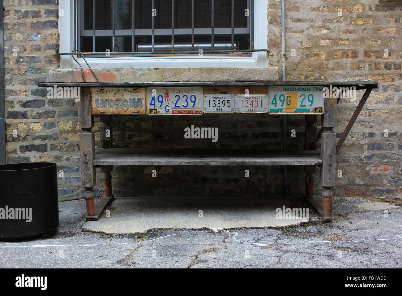 Rusted And Old Vintage License Plate Work Table In The Back Alley