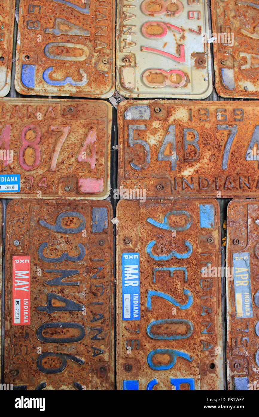 Rusted and old vintage license plate work table in the back Alley of Bookman's Alley bookstore in Evanston, Illinois. Stock Photo