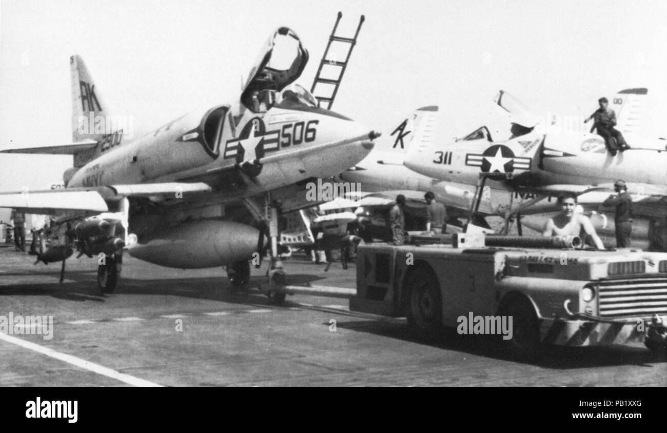 A-4B of VA-95 is towed on the flight deck of USS Intrepid (CVS-11) in 1966. Stock Photo