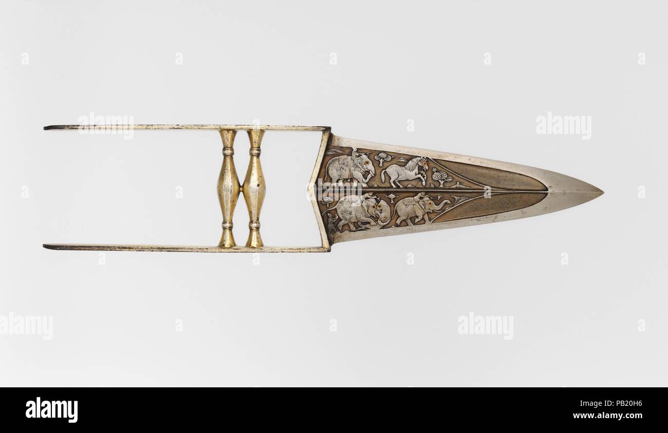 Punch Dagger (Katar) with Sheath. Culture: Indian, Mughal. Dimensions: L. 14 in. (35.6 cm); L. of blade 7 1/4 in. (18.4 cm);  W. 3 3/16 in. (8.1 cm); Wt. 15.2 oz. (430.9 g). Date: late 17th-18th century.  Daggers of this ancient Indian type are known variously as a <i>katar</i> (piercing dagger) or <i>jamadhar</i> (death tooth). Gripped in the fist, they were intended to deliver a deadly punching blow and were used in both war and the hunt. The blade of this example is notable for the delicately chiseled figures of elephants and horses engaged in the hunt. Museum: Metropolitan Museum of Art, N Stock Photo