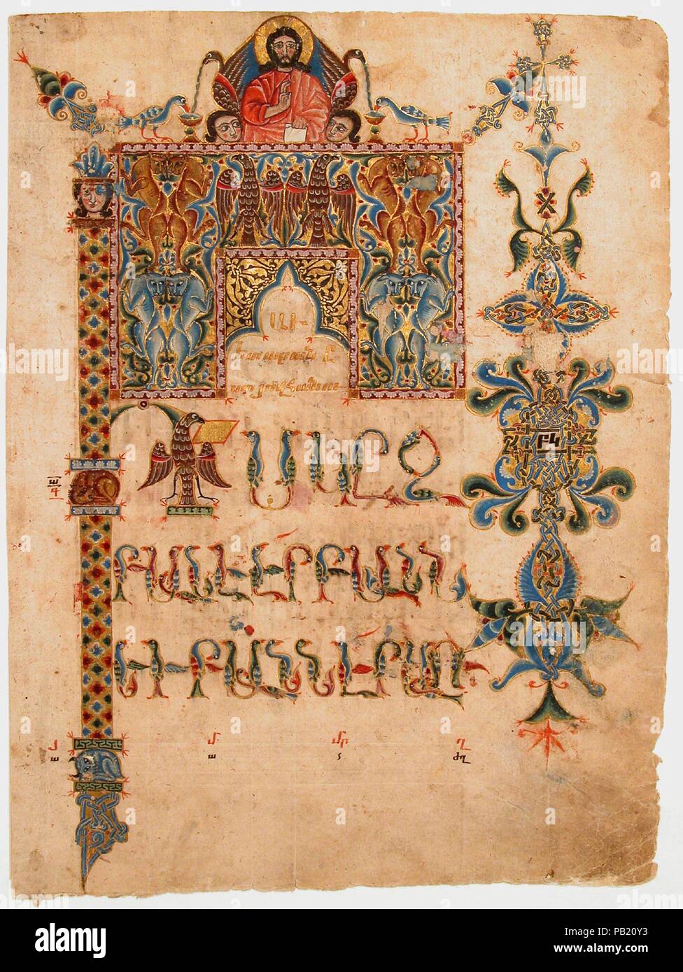 Title Page of the Gospel of John. Dimensions: Page: H. 12 1/2 in. (31.7 cm)  W. 9 1/4 in. (23.5cm)  Mat: H. 19 3/16 in. (48.7 cm)  W. 14 5/16 in. (36.4 cm). Illuminator: Sargis (active early 14th century). Date: 1300-1310.  This richly decorated leaf emphasizes the Gospel of John as the summation of the four Gospels by including the symbols of the four evangelists--an angel for Saint Matthew, a lion for Saint Mark, an ox for Saint Luke, an eagle for Saint John--in the large first letter, or incipit, and in the elaborate headpiece over the text. Byzantine-style geometric patterns fill the rest  Stock Photo