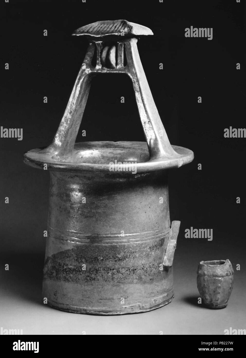 Model of Wellhead with Bucket. Culture: China. Dimensions: H. 14 7/8 in. (37.8 cm); W. 8 3/4 in. (22.2 cm). Museum: Metropolitan Museum of Art, New York, USA. Stock Photo