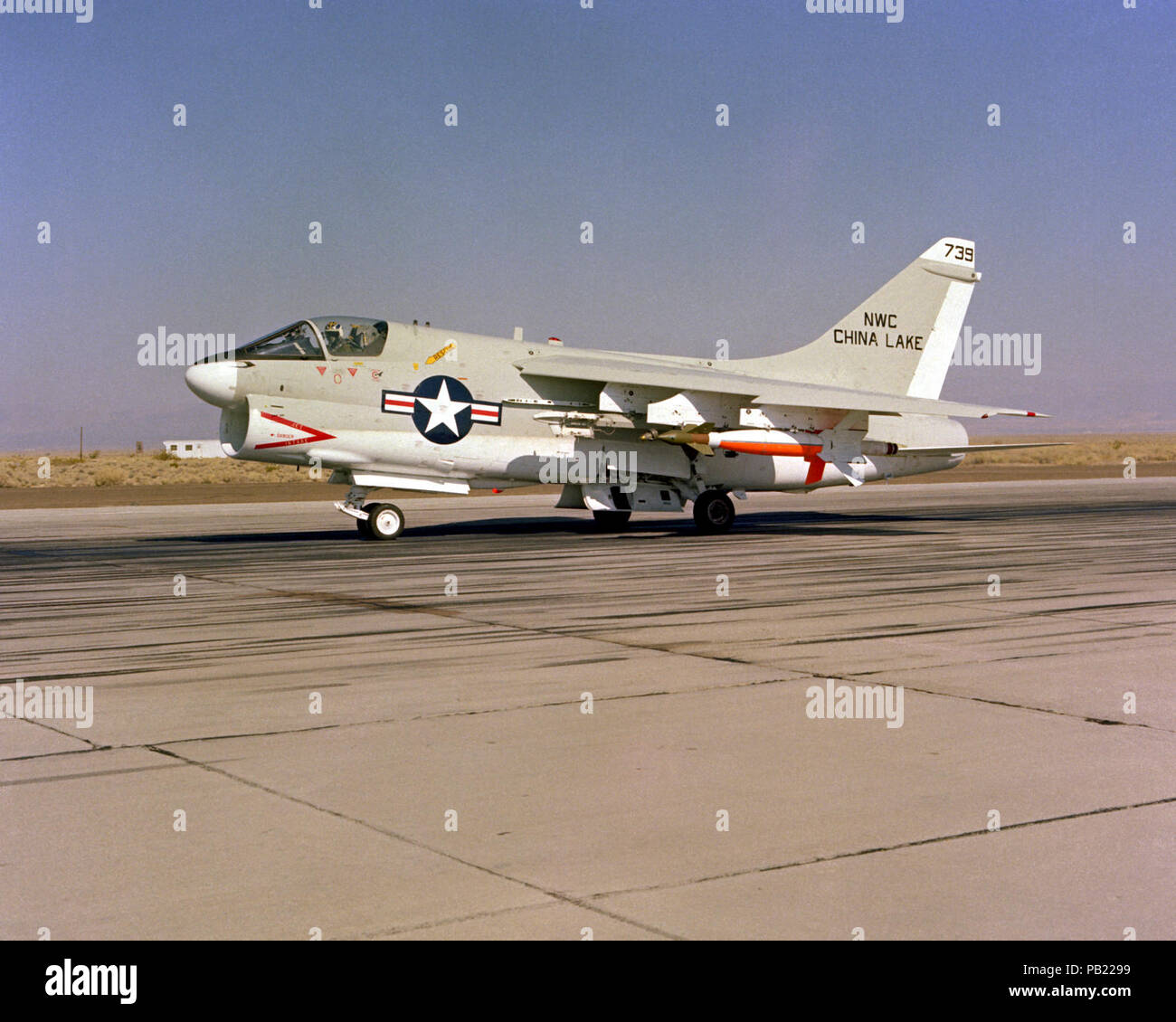 A-7C Corsair II with laser-guided bomb at the Naval Weapons Center China Lake on 6 October 1980. A left front ground view of an A-7C Corsair II aircraft with a Skipper Laser-Guided Bomb (LGB) mounted under its wing. Stock Photo
