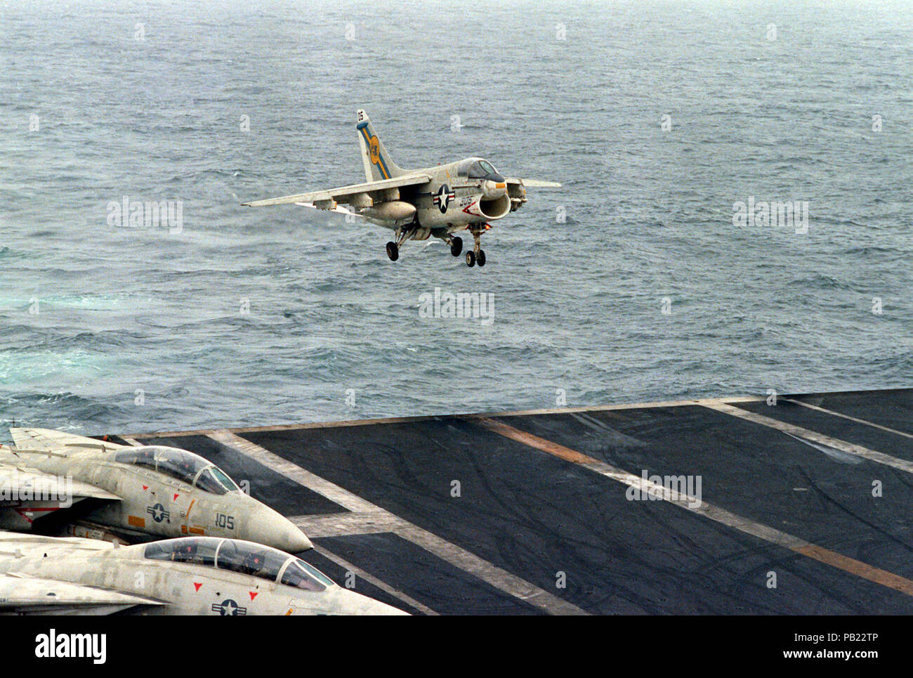 A-7E VA-66 landing on USS Eisenhower (CVN-69) 1980. An A-7E Corsair II aircraft approaches the flight deck for an arrested landing aboard the nuclear-powered aircraft carrier USS DWIGHT D. EISENHOWER.  The A-7E is assigned to LIght Attack Squadron 66 (VA-66). Stock Photo