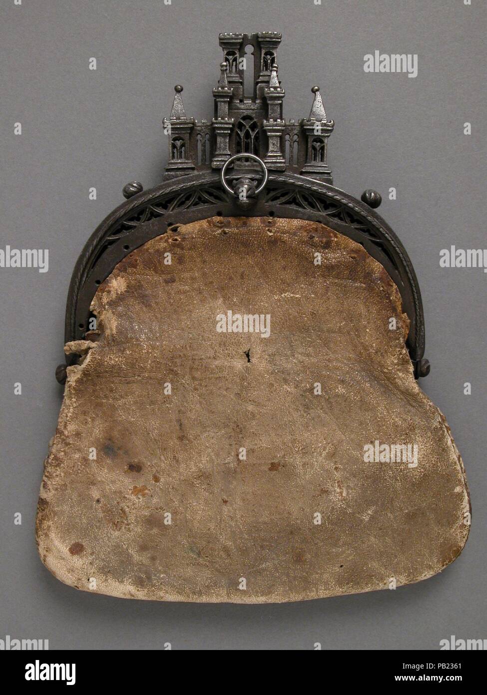 Purse. Culture: European. Dimensions: Overall: 9 x 7 1/16 x 1 5/8 in. (22.9 x 17.9 x 4.1 cm)  purse clasp only: 5 x 6 x 1 5/8 in. (12.7 x 15.2 x 4.1 cm). Date: 15th-16th century.  Purses of various shapes and sizes, carried by both men and women, were given descriptive terms in medieval inventories, such as bourse or poche à compartement. In the fifteenth century, purses with clasps of metal and loops on the rear which could be attached directly to the belt superseded the pouches which closed with drawstrings and hung from the belt. The clasp no doubt came into use to provide greater security  Stock Photo
