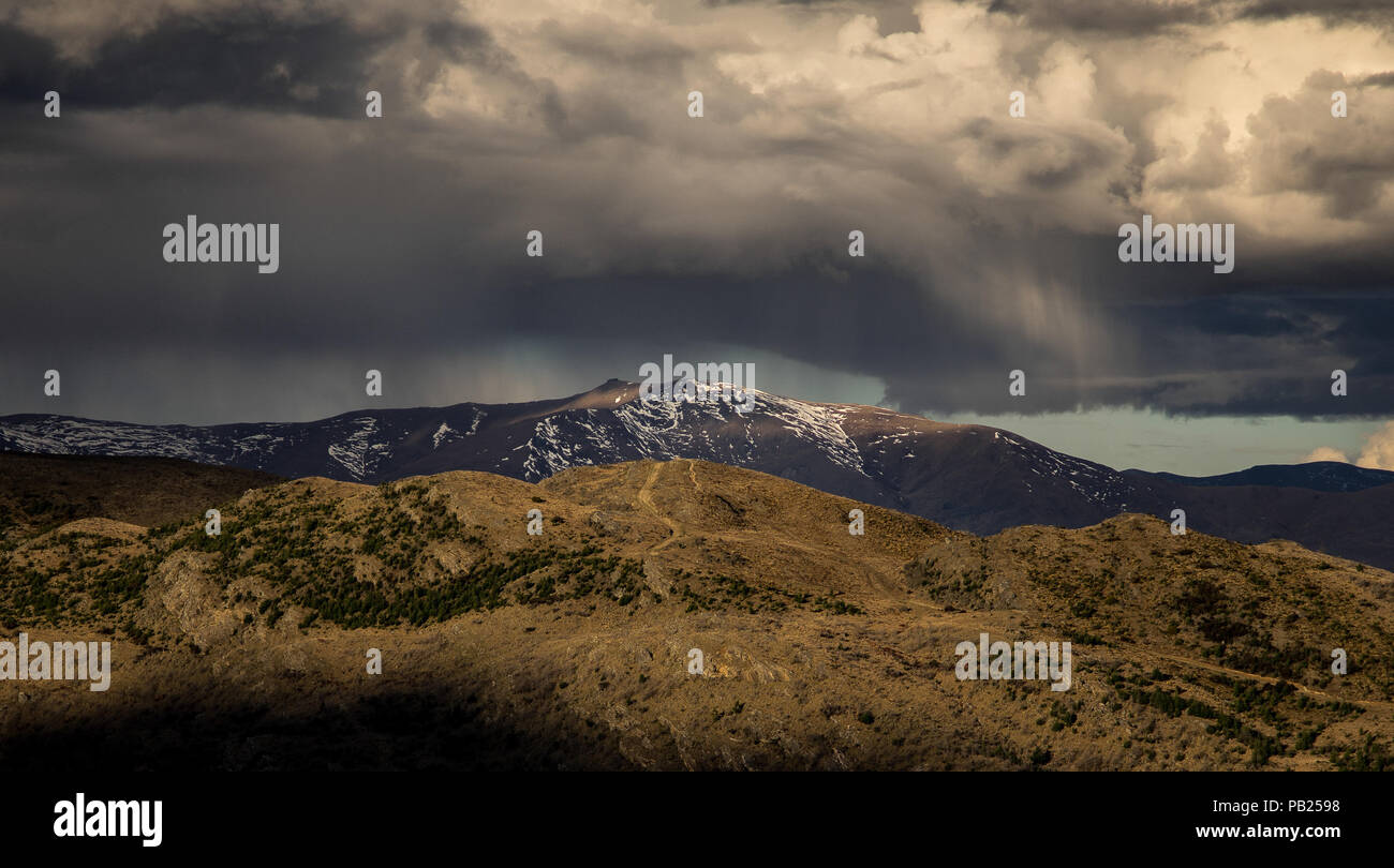 Dramatic rain storm cloud form over the snow mountain in New Zealand Stock Photo