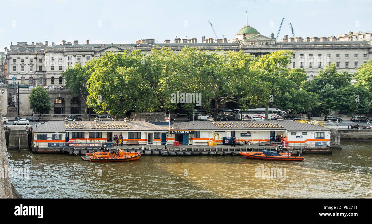 RNLI Tower Lifeboat Station, the UK's busiest, below Waterloo Bridge and Somerset House on Victoria Embankment; north Bank  River Thames, London, UK. Stock Photo