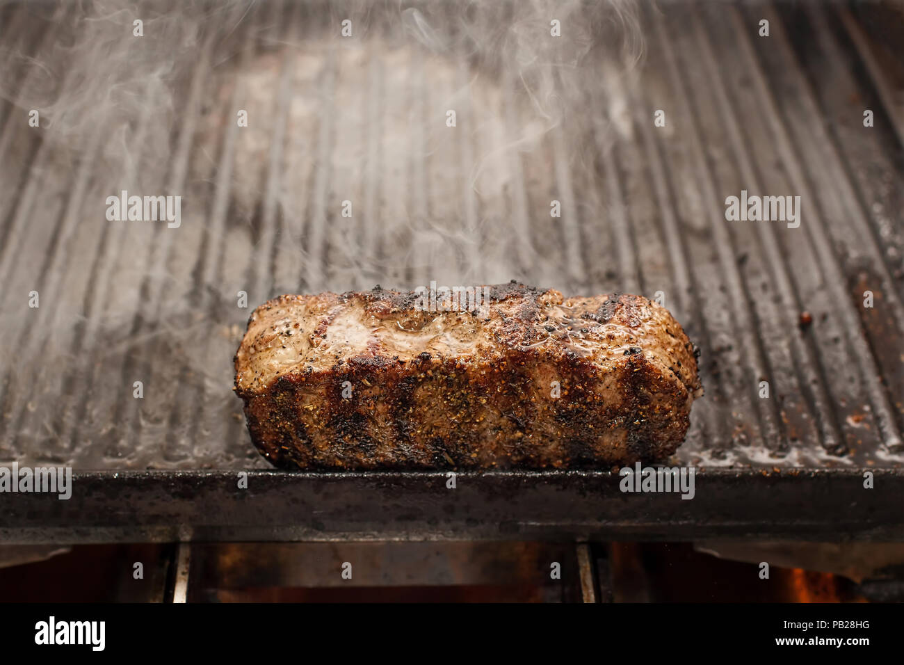 sizzling beef stake on a grill, horizontal Stock Photo