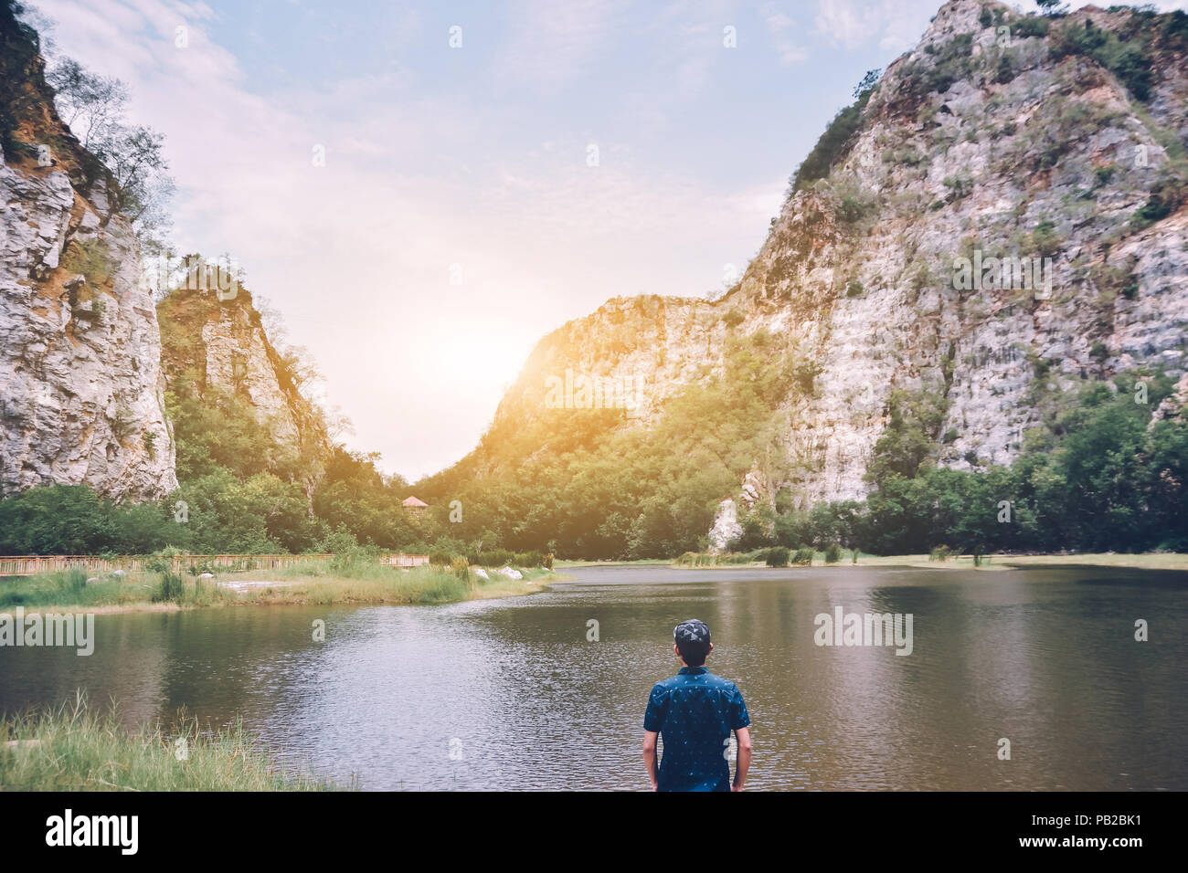Man standing at river mountain background nature sunlight ,Travel in  Thailand Stock Photo - Alamy