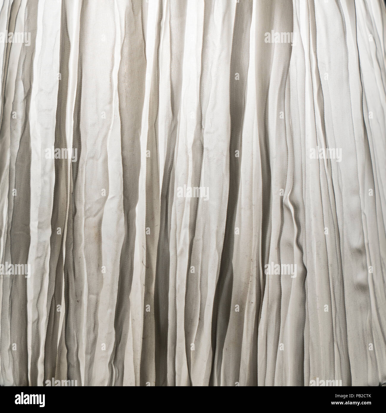 a crumpled white curtain as a background Stock Photo