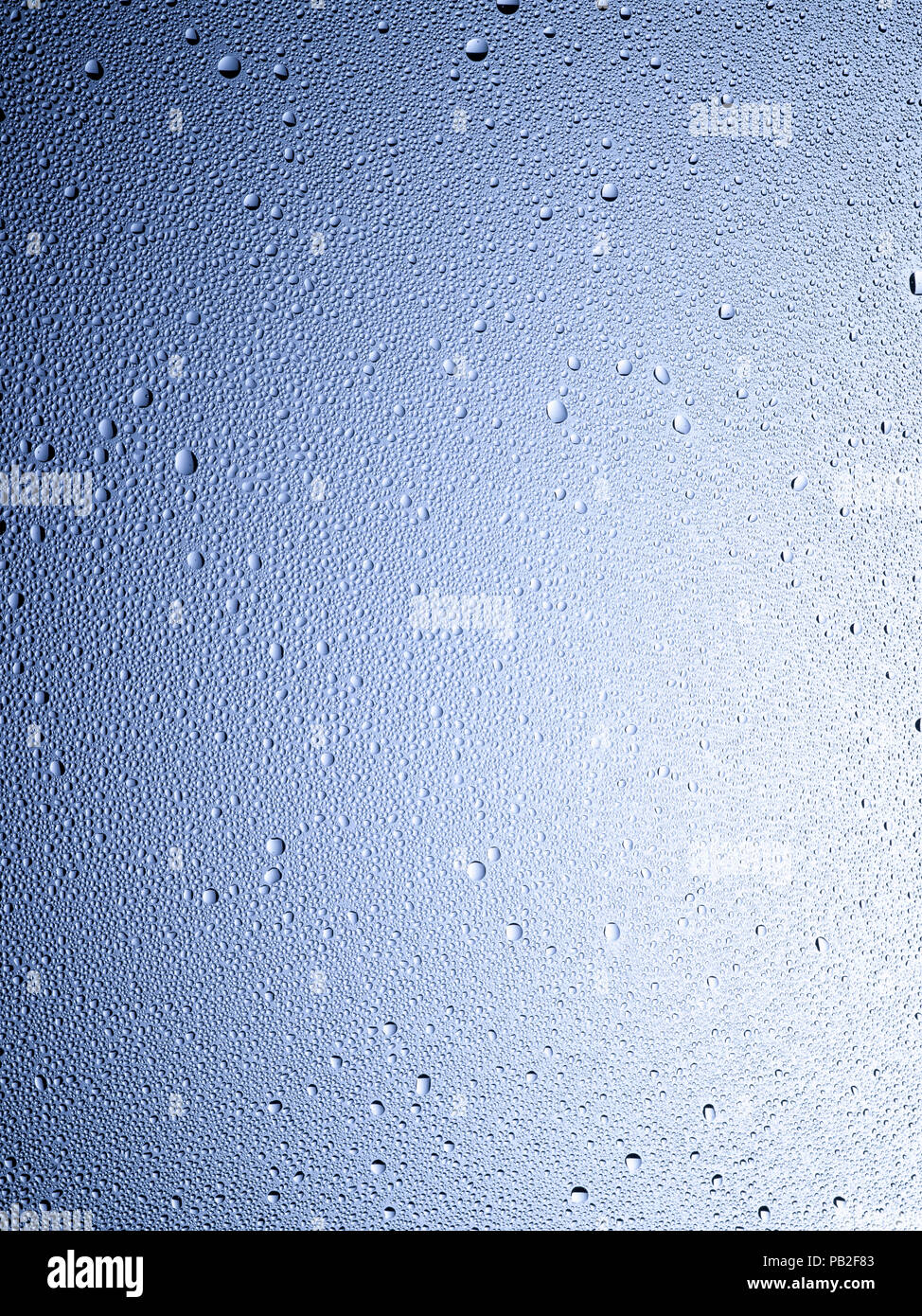 A graphic vertical framed shot of some dew, droplets or condensation. Stock Photo