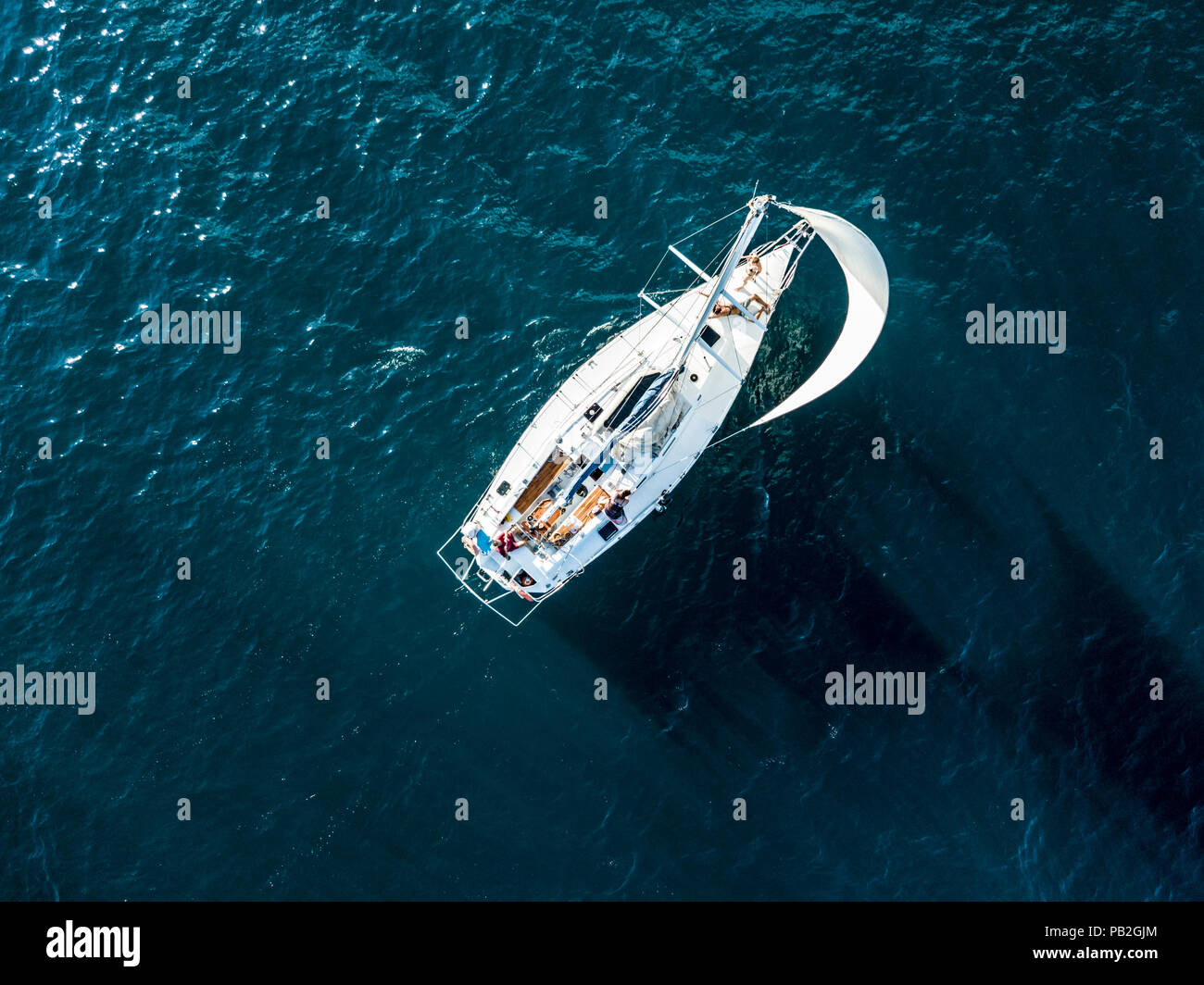 aerial photo of sailboat yacht top view, isolated on the sea texture.  participant of sea regatta Stock Photo - Alamy