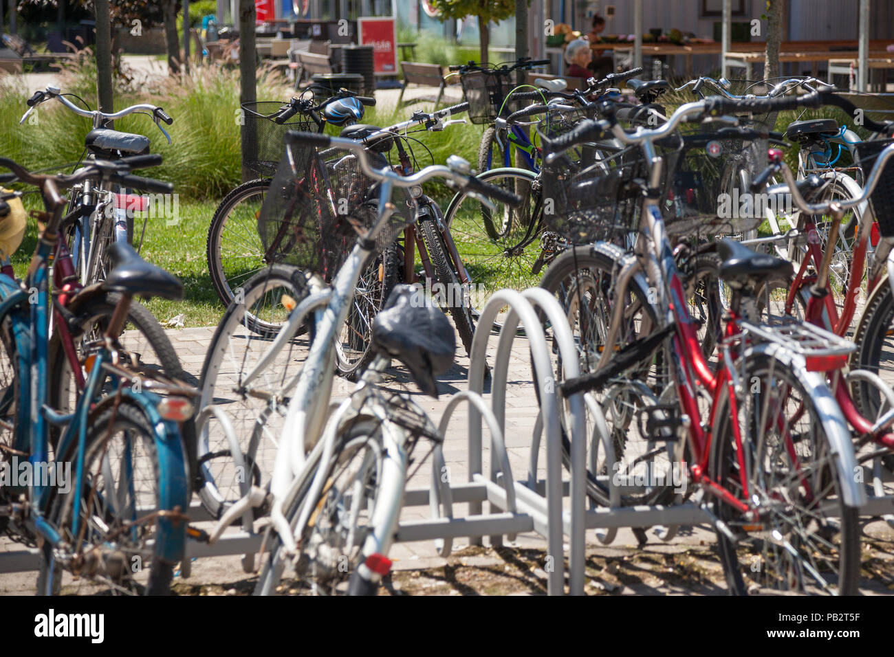 SZEGED, HUNGARY - JUNE 3, 2018: Bicycles raks full of bikes parked by  communters near the Szeged market. Hungary is famous for his huge use of  bicycle Stock Photo - Alamy
