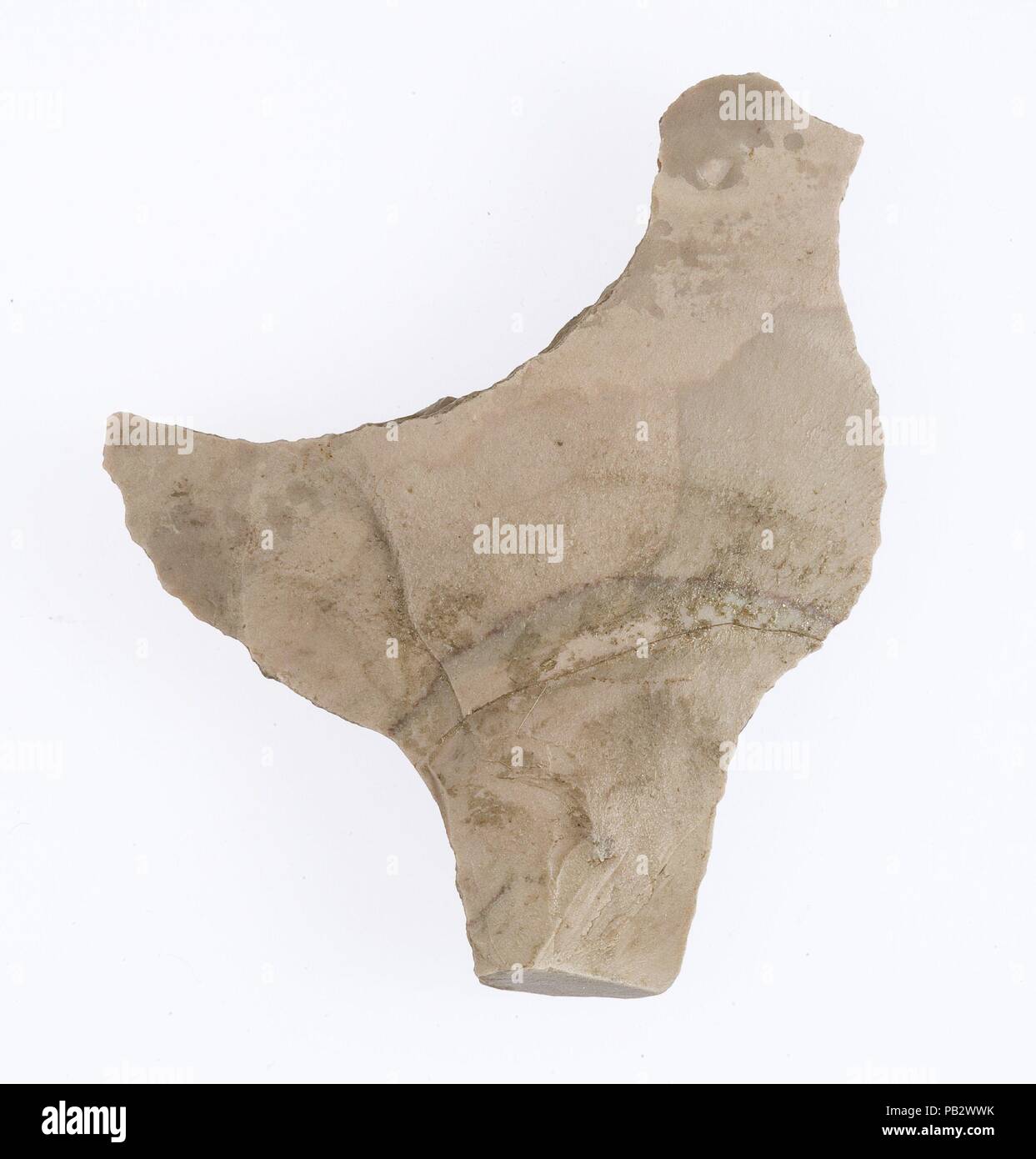 Tool (?), bird shaped. Dimensions: h. 2 7/8 in (7.4 cm); w. 2 7/16 in (6.1 cm); th. 3/8 in (1 cm). Dynasty: Naqada II-Dynasty 1. Date: ca. 3300-2900 B.C.. Museum: Metropolitan Museum of Art, New York, USA. Stock Photo