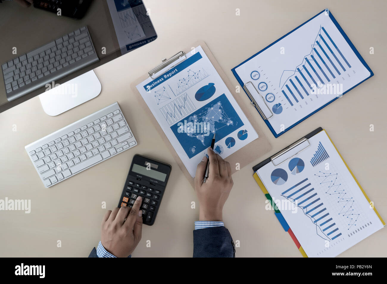analyzing the work Accounting on Laptop investment concept Stock Photo