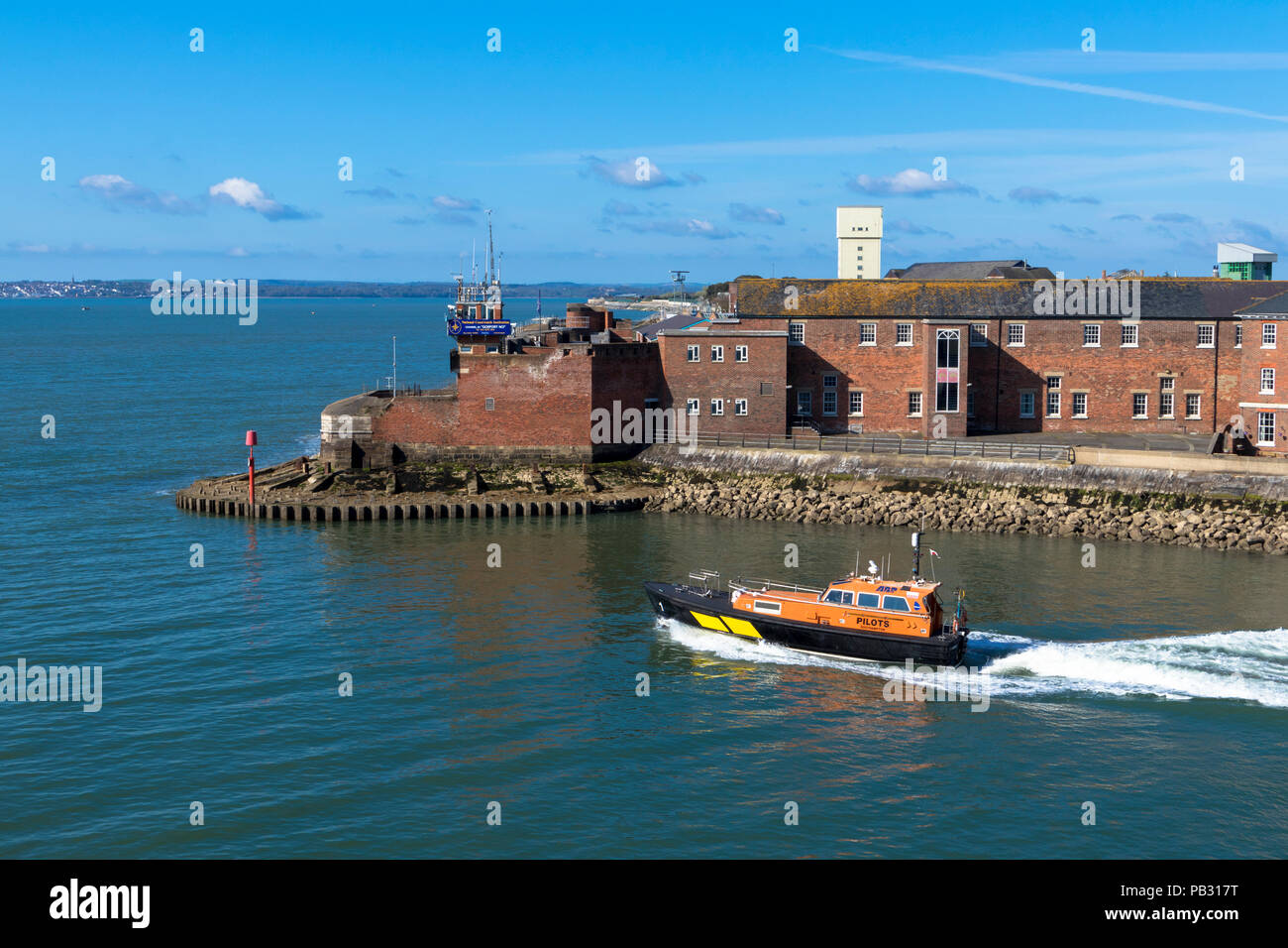 An Associated British Ports pilot vessel heading out of Portsmouth Harbour past Fort Blockhouse England Stock Photo