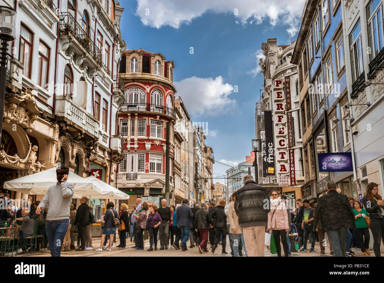 View along the 1.5km  Rua Santa Catarina with people waiting in line queueing to enter the Majestic Cafe and signs of the retail atores in plain view. Stock Photo