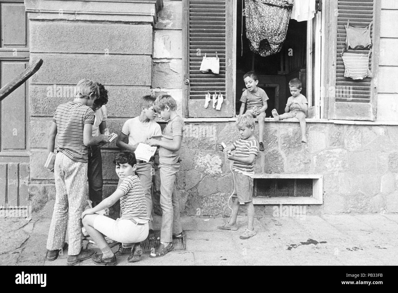 italy, boys playing in the street, 1970 Stock Photo