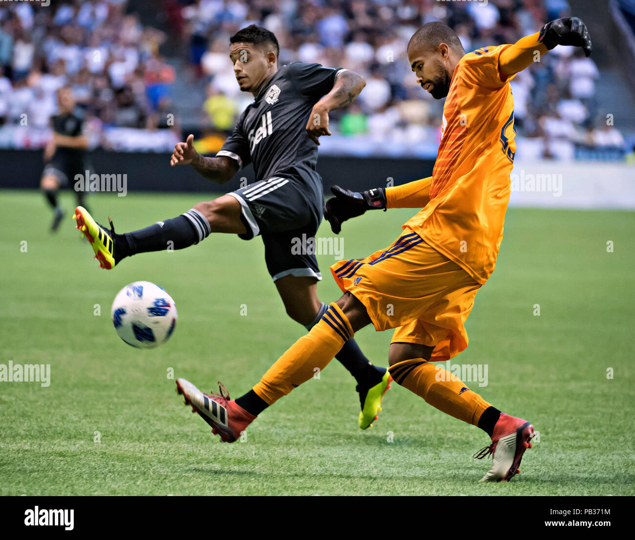 (180726) -- VANCOUVER, July 26, 2018(Xinhua) -- Cristian Techera (L) of Vancouver Whitecaps and Clement Diop of Montreal Impact compete for the ball during the semifinal matches of the Canadian Championship at BC Place in Vancouver, Canada, July 25, 2018. Vancouver Whitecaps FC won 2-0. (Xinhua/Andrew Soong) Stock Photo