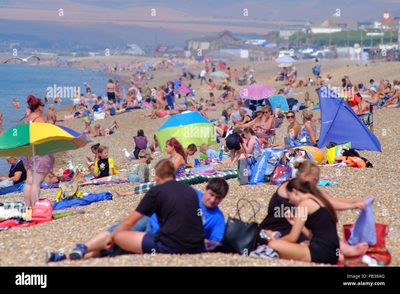 Seaford, East Sussex, UK. 26th July 2018. Temperatures already rising on Seaford Beach, East Sussex. © Peter Cripps/Alamy Live News Stock Photo
