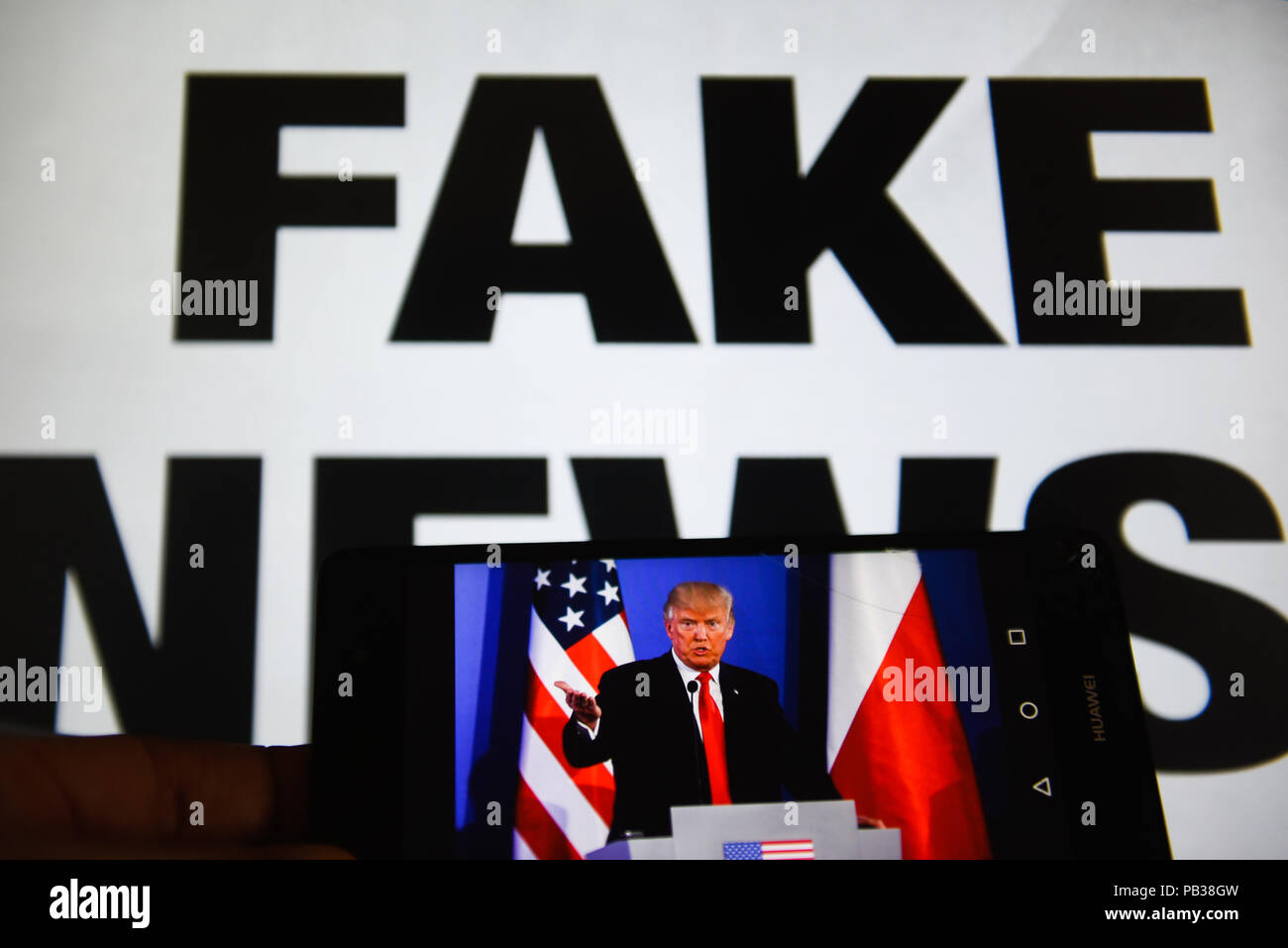 Krakow, Poland. 26th July, 2018. A mobile phone shows President of United States of America, Donald Trump with a sentence saying ''Fake News'' on the background. Credit: Omar Marques/SOPA Images/ZUMA Wire/Alamy Live News Stock Photo