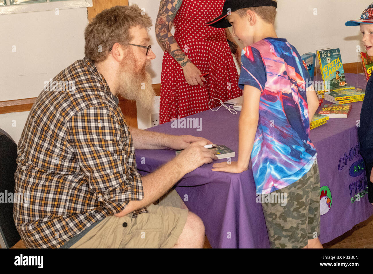 Brentwood, Essex, UK. 26th July 2018 Brentwood Children’s literary festival presented a workshop by A F Harrold, poet, writer and performance artist.  Author of Greta Zargo and the Death Robots from Outer Space and Greta Zargo and the Amoeba Monsters from the Middle of the Earth. Credit Ian Davidson/Alamy Live News Stock Photo