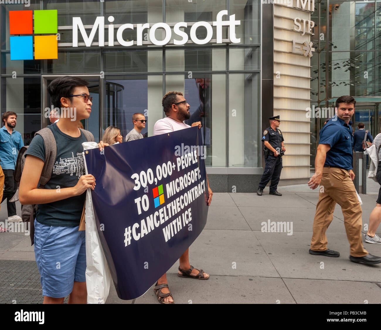 New York, USA. 26th July 2018. Activists gather in front of Microsoft's New York offices on Thursday, July 26, 2018  to protest the tech company supplying technology to Immigration and Customs Enforcement (ICE).Over 300,000 have signed petitions calling on Microsoft to cancel their contract with ICE because of ICE's activities separating immigrant parents from their children. Similar protests are taking place at other Microsoft offices around the country. (© Richard B. Levine) Credit: Richard Levine/Alamy Live News Stock Photo