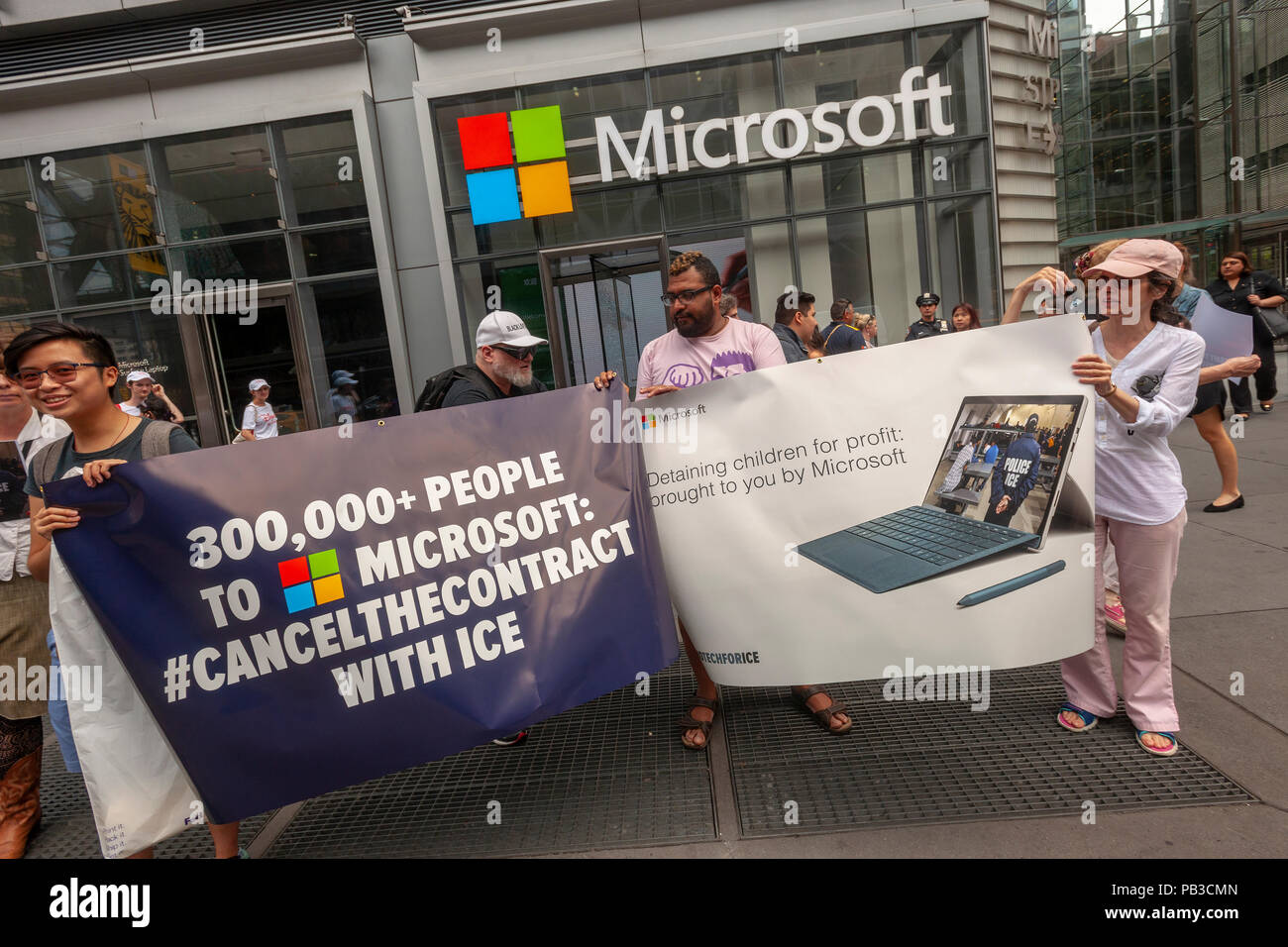 New York, USA. 26th July 2018. Activists gather in front of Microsoft's New York offices on Thursday, July 26, 2018  to protest the tech company supplying technology to Immigration and Customs Enforcement (ICE).Over 300,000 have signed petitions calling on Microsoft to cancel their contract with ICE because of ICE's activities separating immigrant parents from their children. Similar protests are taking place at other Microsoft offices around the country. (Â© Richard B. Levine) Credit: Richard Levine/Alamy Live News Stock Photo
