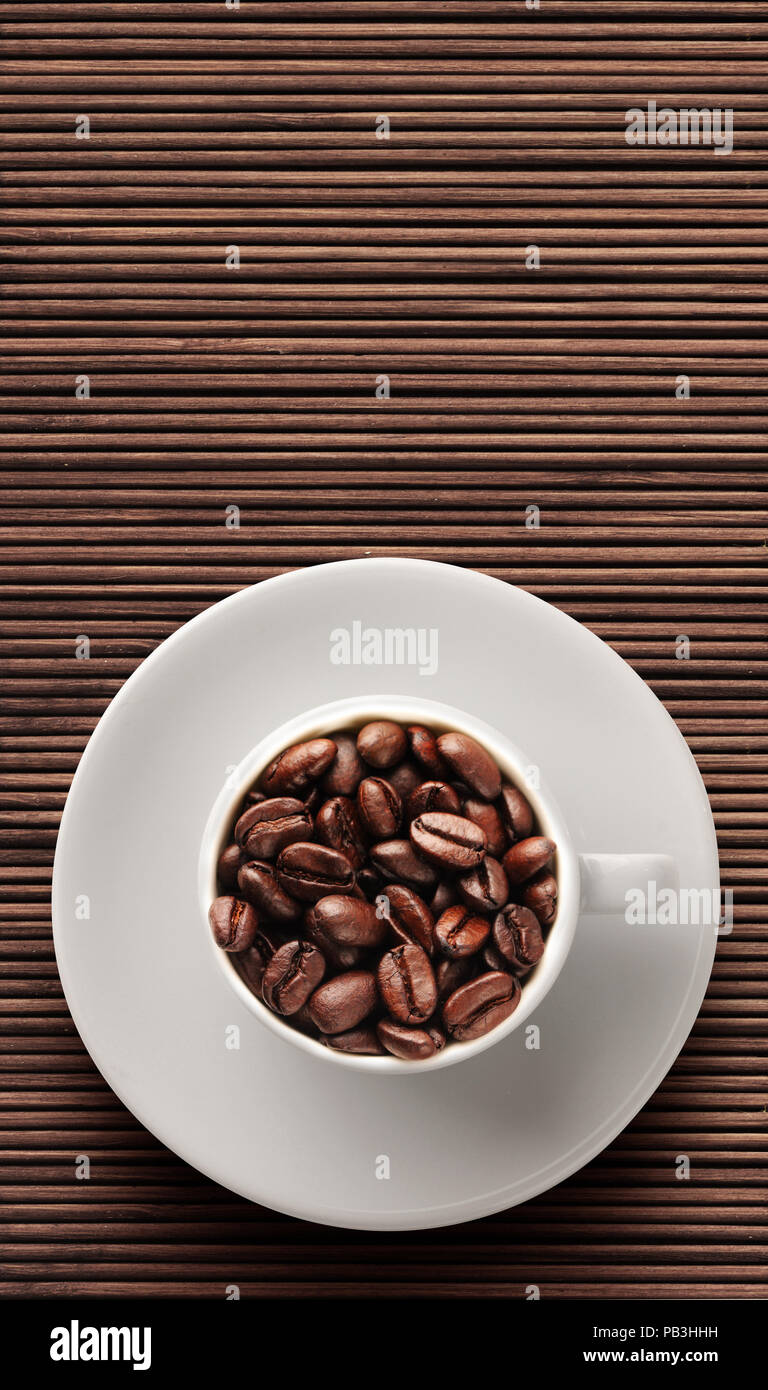 https://c8.alamy.com/comp/PB3HHH/coffee-beans-on-bamboo-floor-PB3HHH.jpg