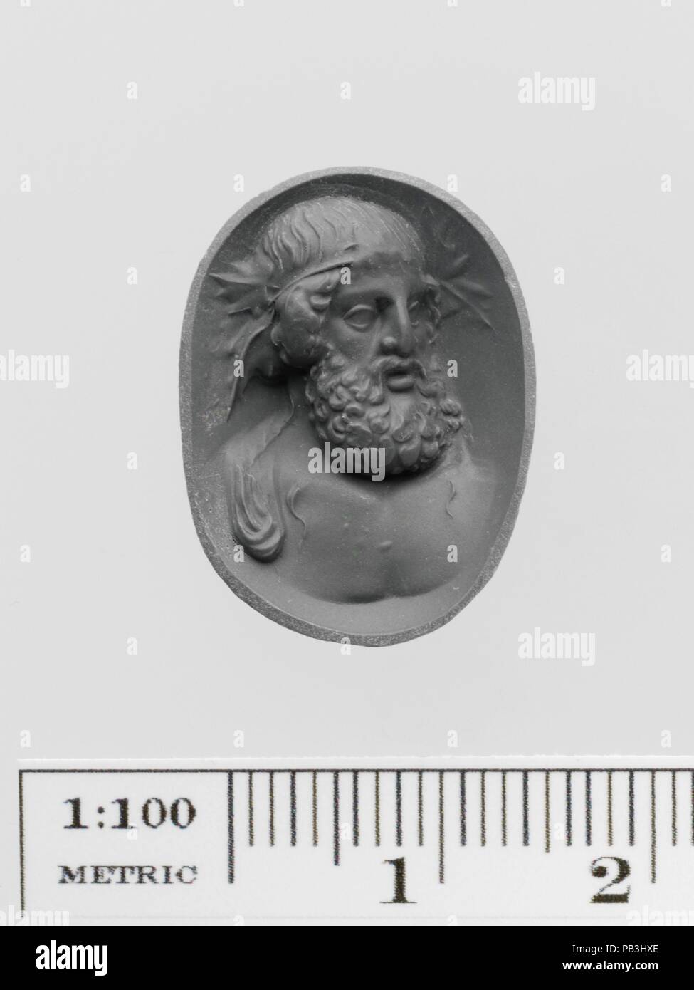 Amethyst ring stone with a bust of Dionysos. Culture: Roman. Dimensions: Overall: 7/8 x 5/8in. (2.2 x 1.6cm). Date: 1st-2nd century A.D..  The god of wine is depicted as an older man with a full beard and wearing a wreath of vine leaves. Museum: Metropolitan Museum of Art, New York, USA. Stock Photo