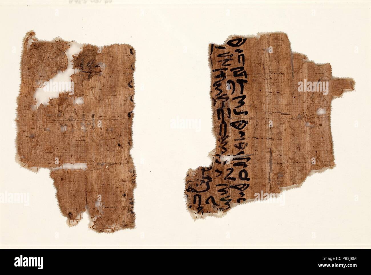 Three frames with papyrus fragments. Dimensions: Framed (a): H. 13 cm (5 1/8 in.); W. 19.1 cm (7 1/2 in.)  Framed (b): H. 13 cm (5 1/8 in.); W. 29.2 cm (11 1/2 in.)  Framed (c): H. 13 cm (5 1/8 in.) squared. Dynasty: Dynasty 12-13. Date: ca. 1981-1640 B.C.. Museum: Metropolitan Museum of Art, New York, USA. Stock Photo