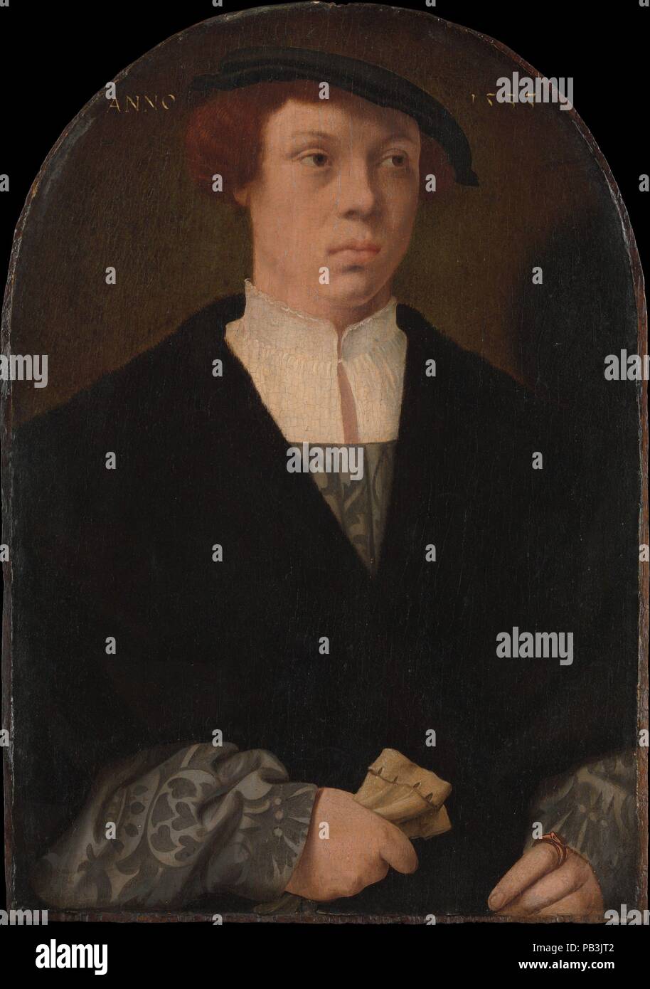 Portrait of a Man. Artist: Barthel Bruyn the Elder (German, 1493-1555). Dimensions: Overall, with arched top, 12 x 8 7/8 in. (30.5 x 22.5 cm); painted surface 11 3/4 x 8 1/8 in. (29.8 x 20.6 cm). Date: 1533.    The sitters wear costumes typical of the upper-class citizenry of Cologne, whose members were Bruyn's usual patrons. The woman's exposed hair, visible in braids at either side of her face, indicates that the couple are depicted as engaged, not married, as married women of Cologne wore their hair completely covered. It is likely that the portraits were commissioned to commemorate their e Stock Photo