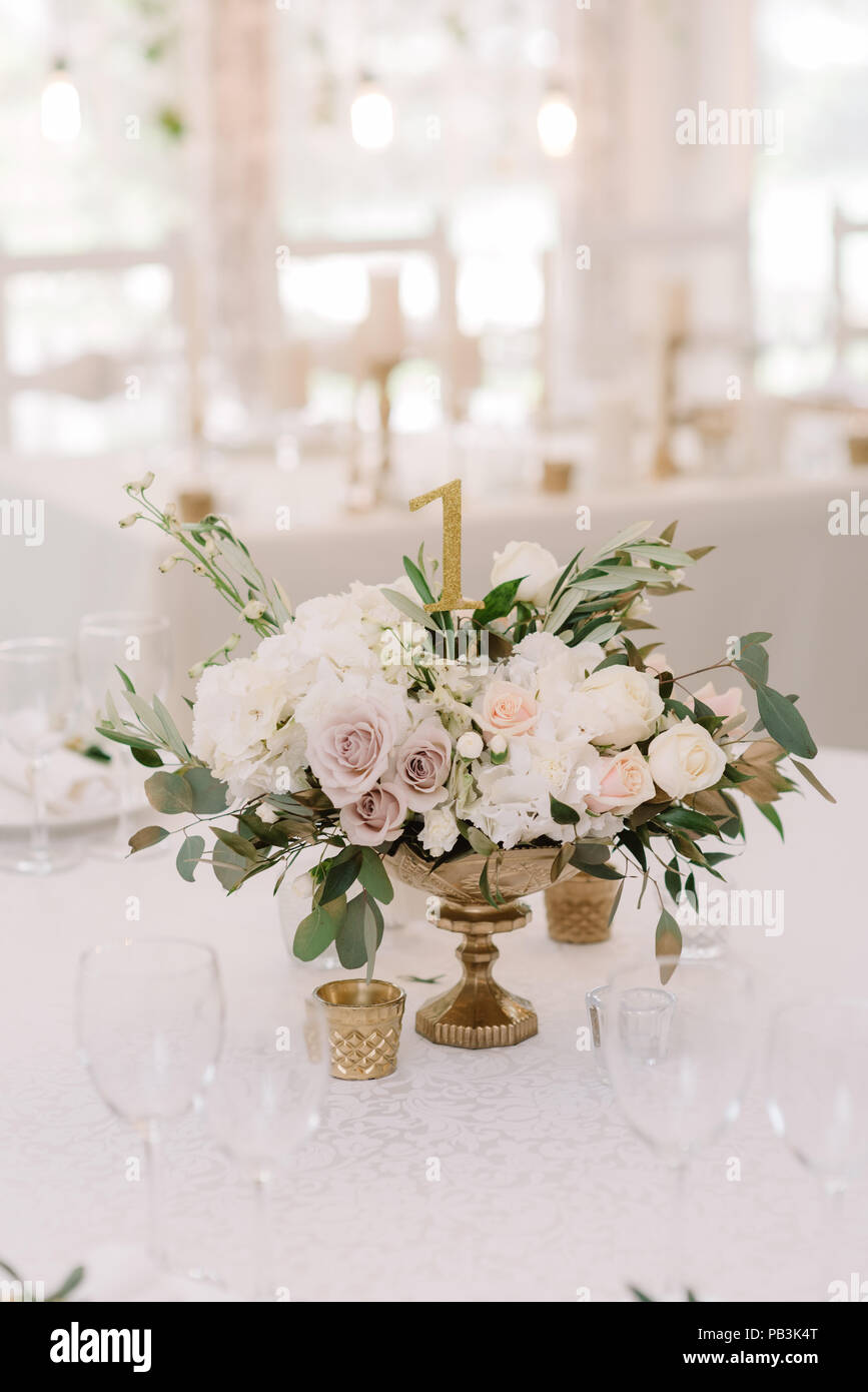 Artificial Flowers in Gold Vase at Room Corner Stock Photo - Alamy