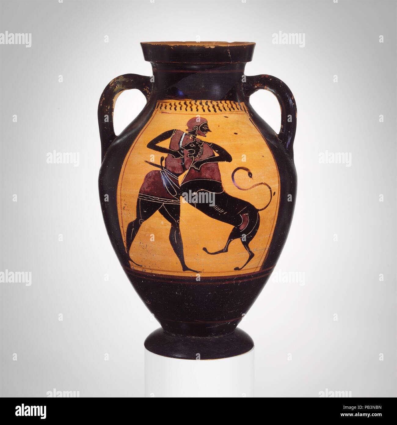 Terracotta amphora (jar). Culture: Greek, Attic. Dimensions: H. 10 9/16 in. (26.9 cm). Date: ca. 540 B.C..  Obverse and reverse, Herakles and the Nemean lion  Within the elongated shape of the amphora, the panel has been stretched proportionately to accommodate the pair of combatants. Although we know the outcome of the struggle, the artist characterized it effectively by showing man and lion as equally matched. Museum: Metropolitan Museum of Art, New York, USA. Stock Photo