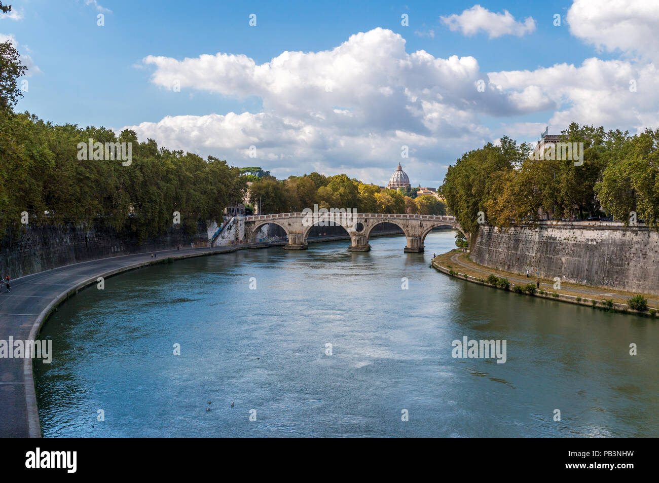 View of Tiber river towards Ponte Sisto and Saint Peter's Basilica, Rome Stock Photo