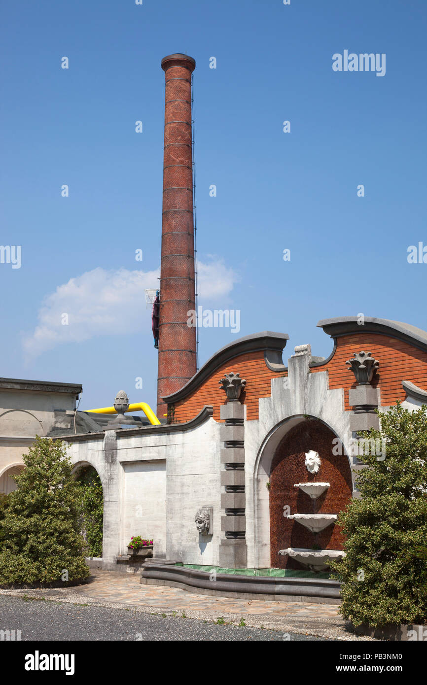 Private gardens of the villa of Ermenegildo Zegna and view of the historical chimney of the Wool Factory Ermenegildo Zegna, Trivero, Biella, Piemonte, Stock Photo