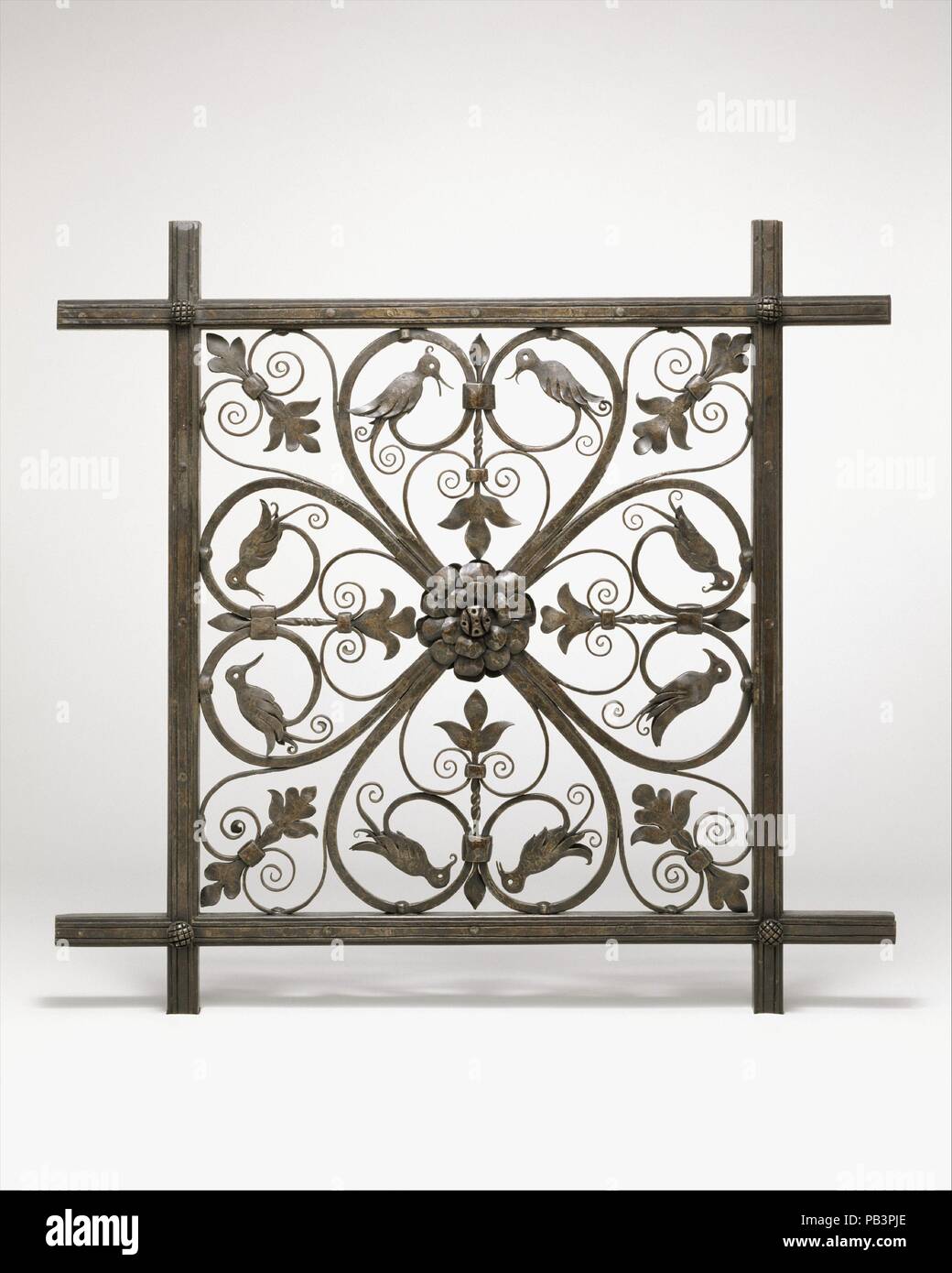 Grille [Prototype for Ceiling Grille for Pierpont Morgan Library Annex]. Culture: American. Dimensions: 33 1/8 x 34 1/2 x 2 13/16 in. (84.1 x 87.6 x 7.1 cm). Maker: Samuel Yellin (American, born Russia, 1884-1940). Date: ca. 1928.  This full-scale prototype of one unit of the large, decorative grille for the Annex of the Pierpont Morgan Library exhibits Yellin's total mastery of his medium--iron--which is crafted here into graceful, Renaissance-inspired filigrees. The design of the openwork square with curling, heart-shaped cartouches containing birds is at once sophisticated and playful, exem Stock Photo