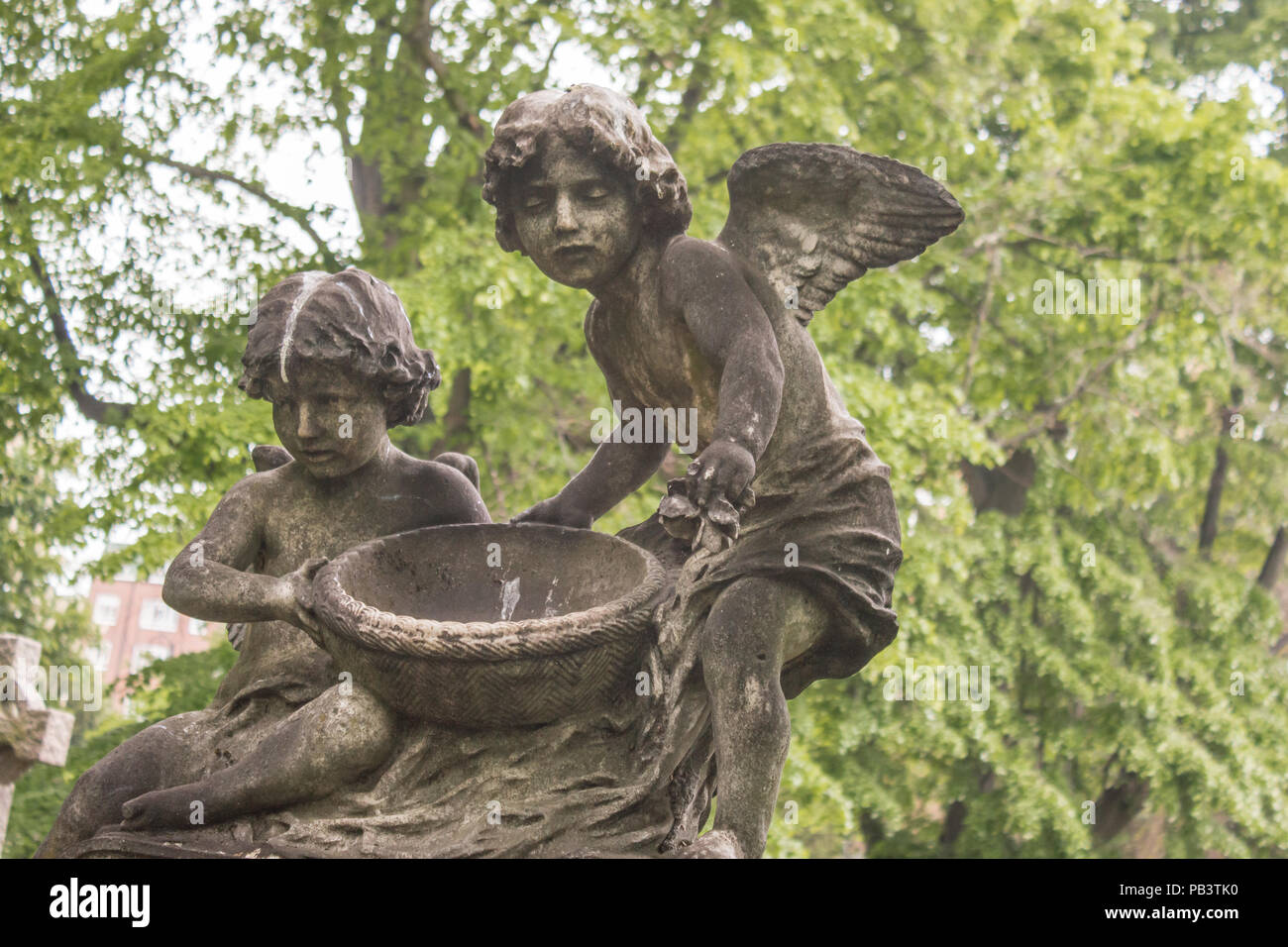 Angels preside over graves in Brompton Cemetary in London, UK. Stock Photo