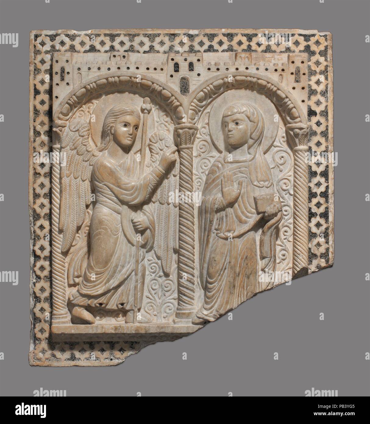 Relief with the Annunciation. Culture: Italian. Dimensions: 26 1/2 x 24 x 4 3/4 in. (67.3 x 61 x 12.1 cm). Date: ca. 1180-1200.  This relief is one of seven panels from a pulpit in the church of San Piero Scheraggio in Florence, which was dismantled sometime between 1410 and 1755. In medieval Italy, pulpits were used for the reading of the Gospels and the Epistles and were located on the south side of the choir. Here, the Virgin and the archangel Gabriel stand in separate niches under a city wall. The fluid treatment of the drapery, the form of the figures, and the combination of narrative rel Stock Photo