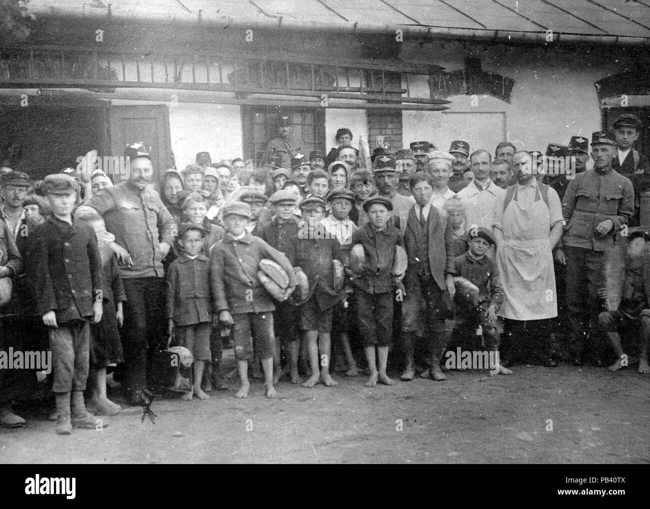 1597 Tableau, women, soldier, men, uniform, kids, yard, ladder, baking man, loaf of bread, railroader Fortepan 4446 Stock Photo