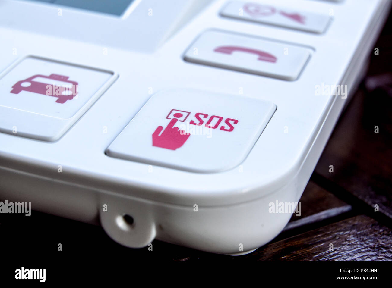 sos Red button on a dirty old panel, selective focus Stock Photo