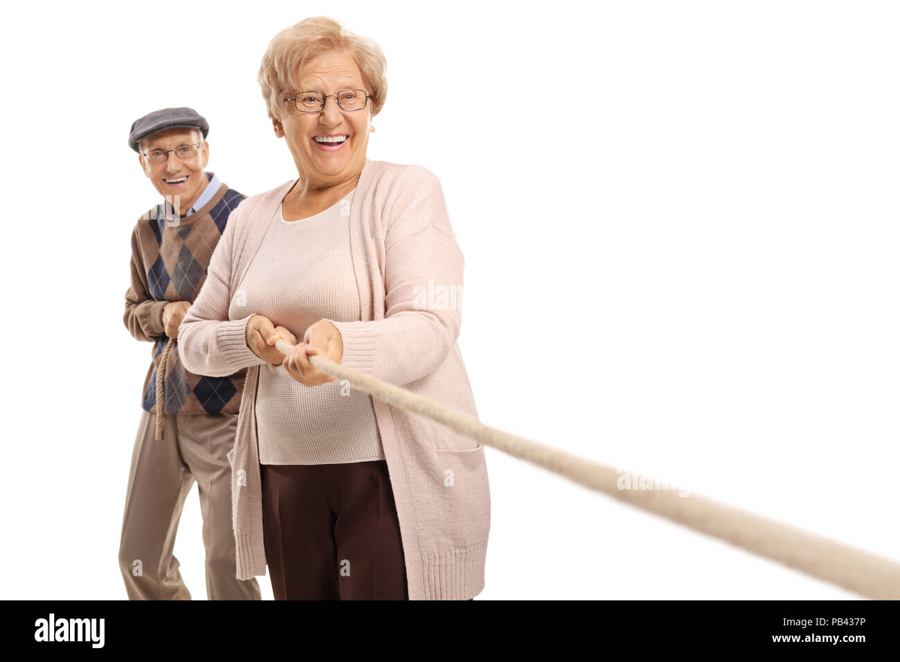 Elderly couple pulling a rope isolated on white background Stock Photo