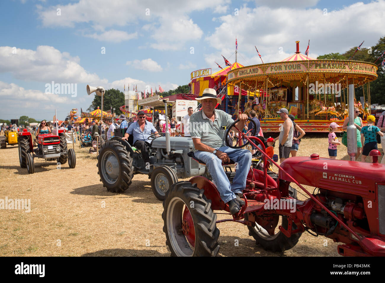A convoy of vintage tractors on display at the 2018 Cheshire Steam Fair Stock Photo