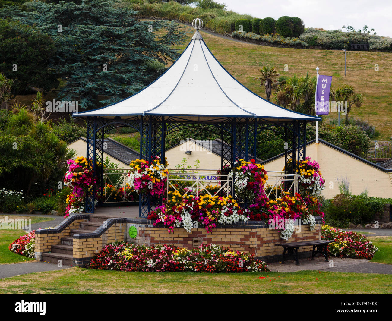 Summer bedding flowers bedeck the Victorian bandstand in Runnymede